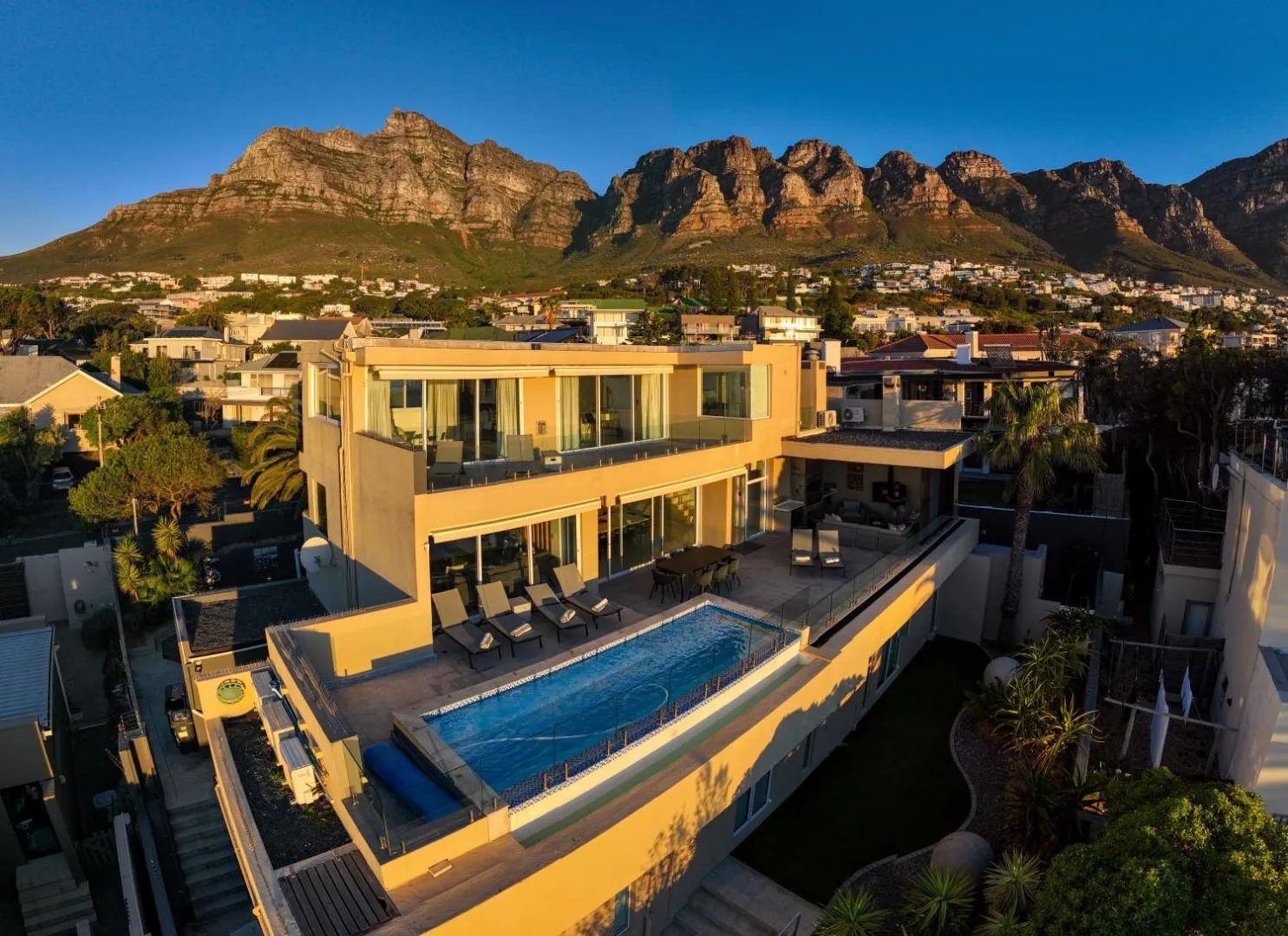 Villa and pool beneath the Twelve Apostles at dusk